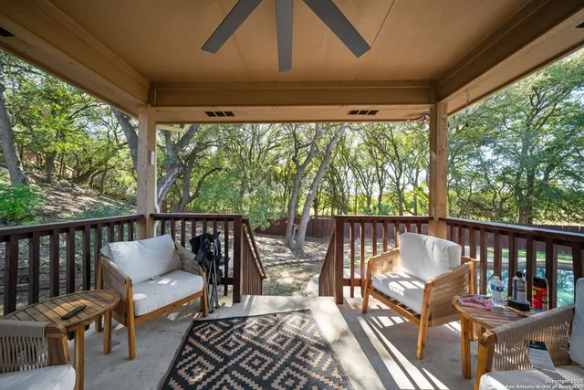 a view of a chair and table in the balcony
