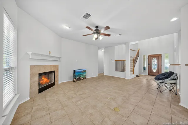 a view of a livingroom with furniture and a fireplace