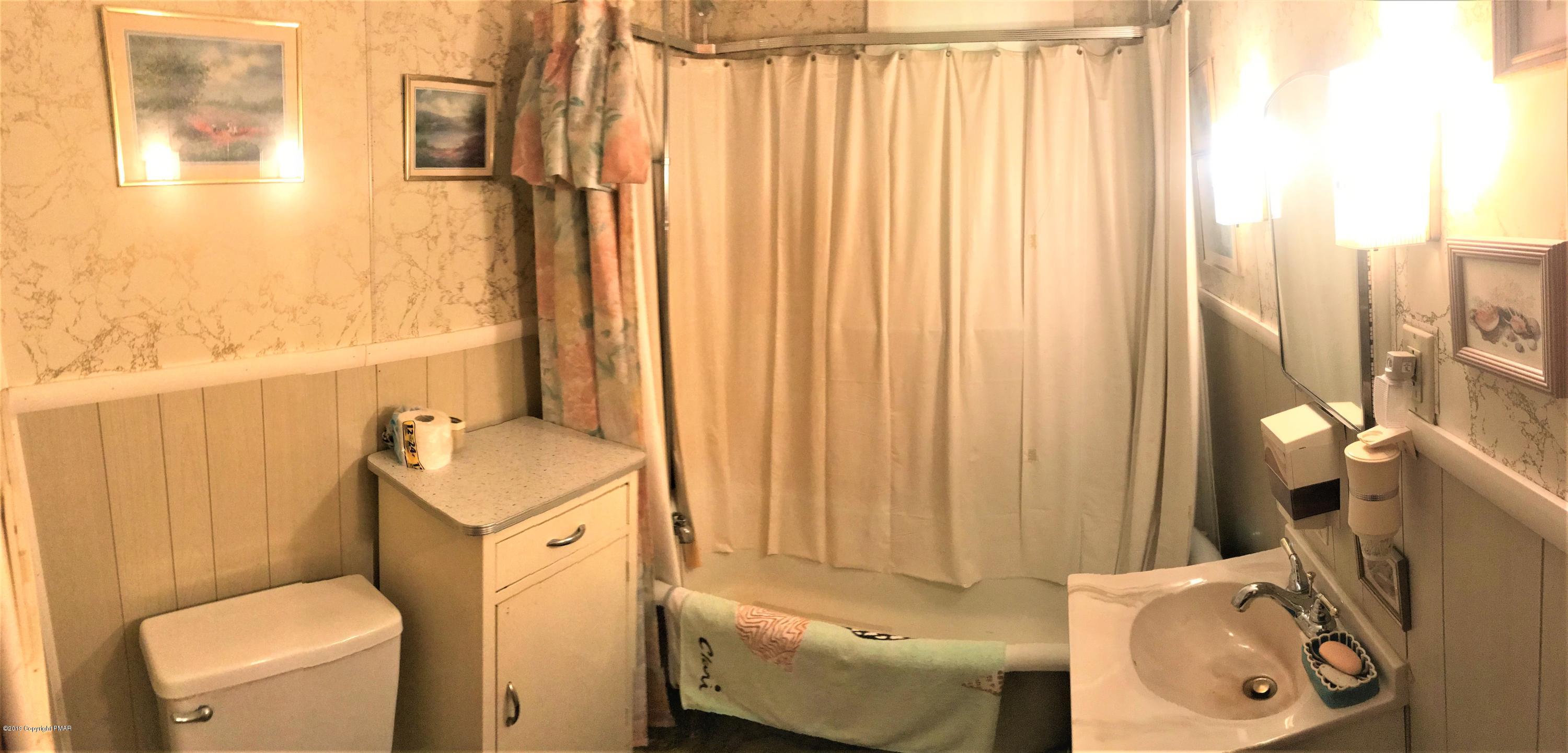 820 Westbrook Road Effort, PA 18330 - Photo 12 of 13 a bathroom with a sink toilet and shower