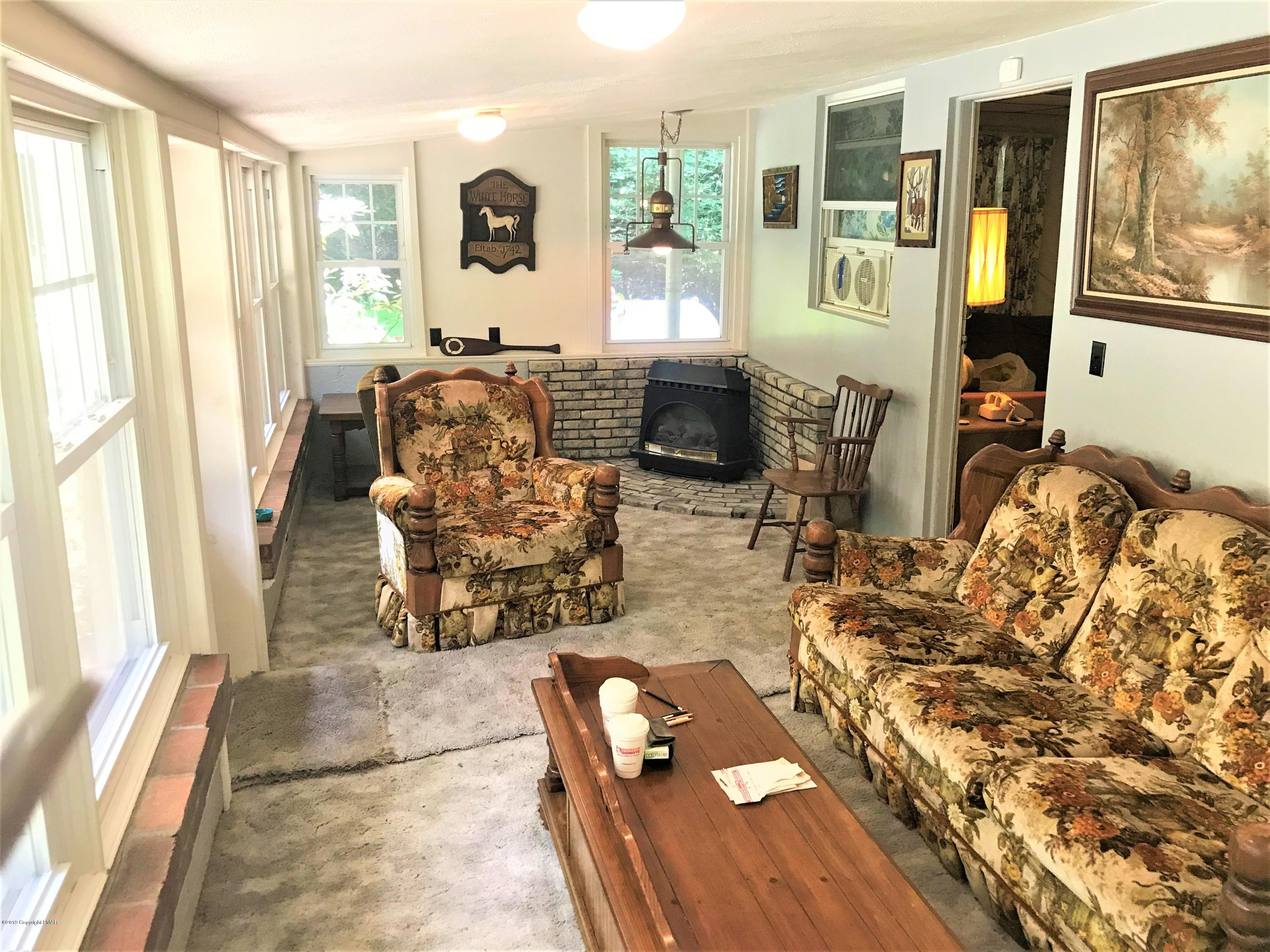 820 Westbrook Road Effort, PA 18330 - Photo 6 of 13 a living room with furniture and large windows