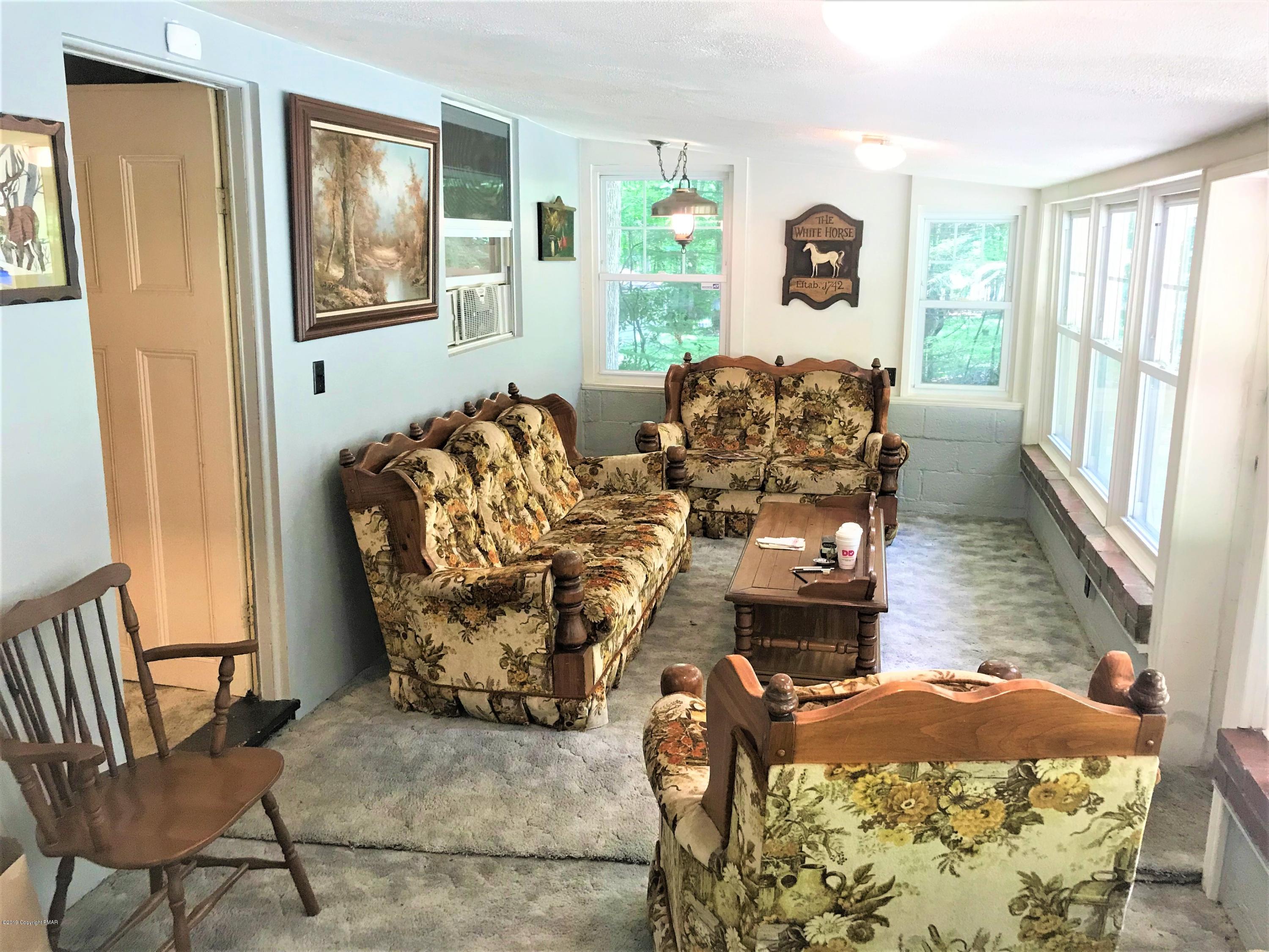 820 Westbrook Road Effort, PA 18330 - Photo 7 of 13 a living room with furniture and a window