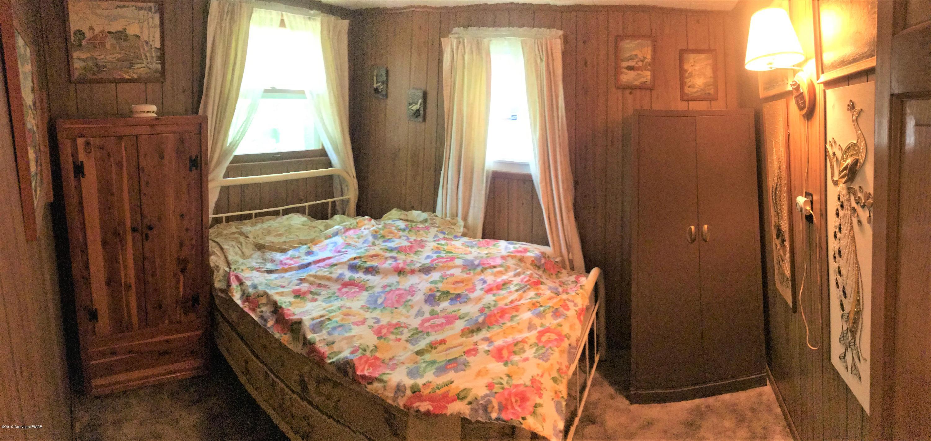 820 Westbrook Road Effort, PA 18330 - Photo 10 of 13 a bedroom with a bed and a window