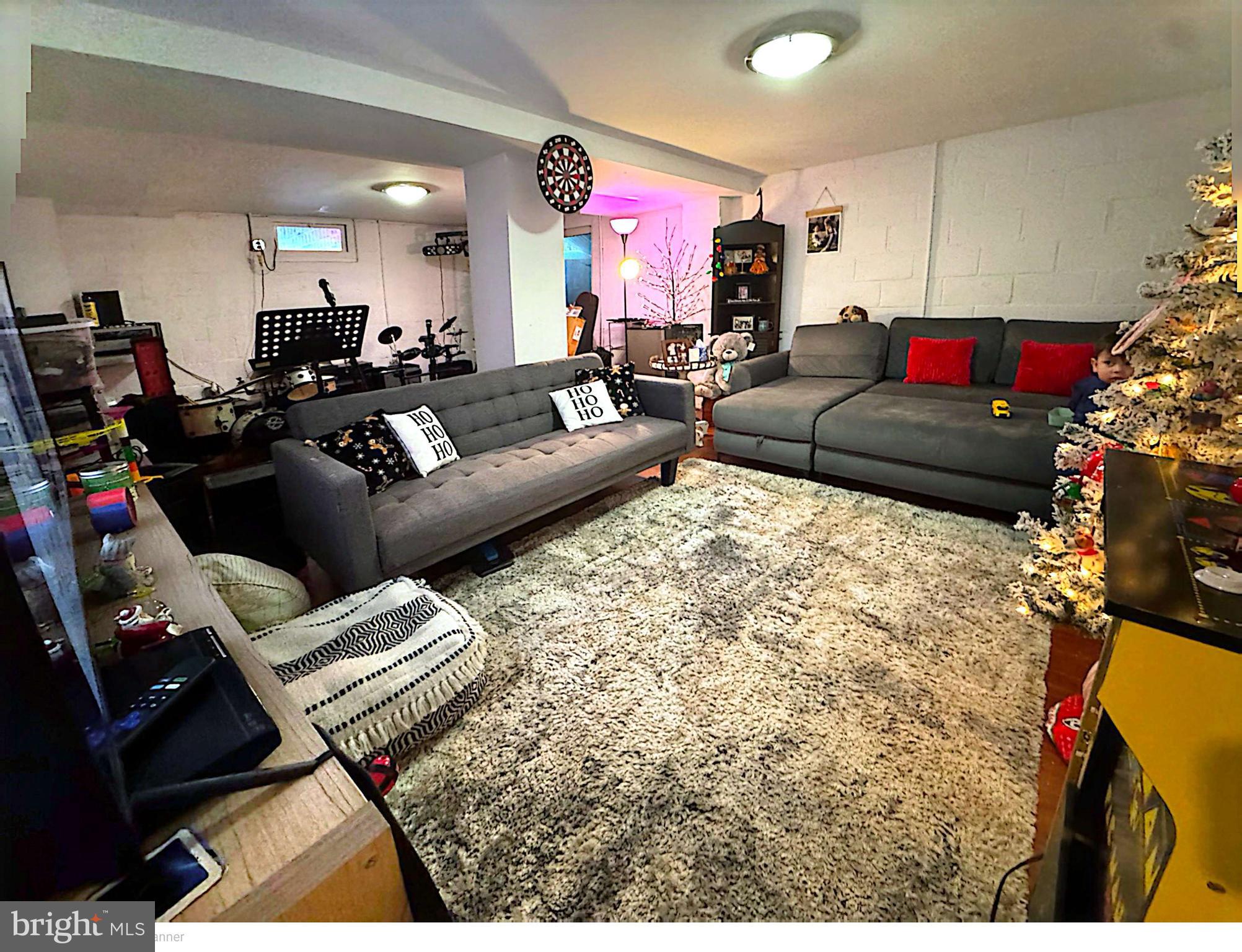 409 Swarthmore Road Glassboro, NJ 08028 - Photo 13 of 14 a living room with furniture or couch and a fireplace