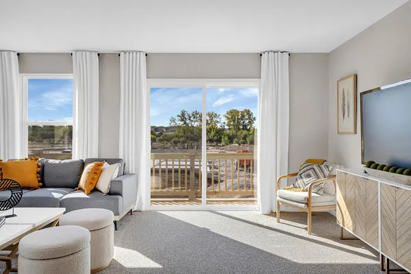 a living room with furniture and a window