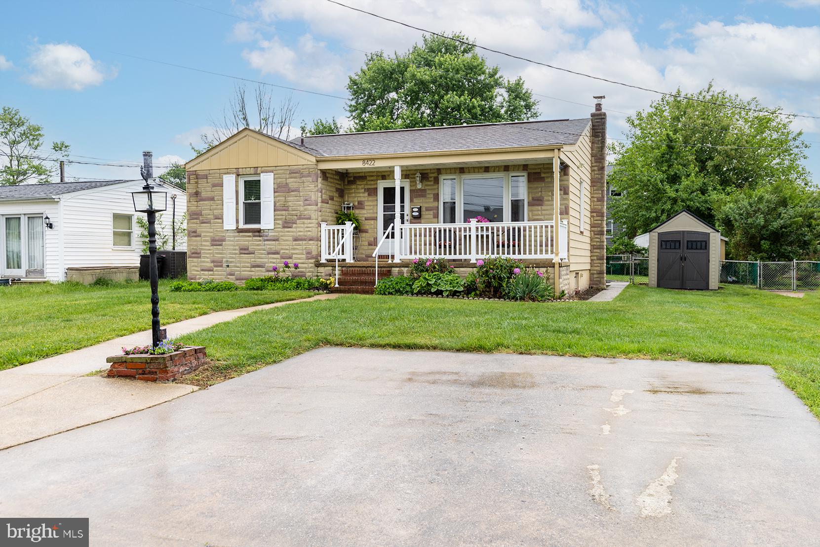 8422 Geneva Road Pasadena, MD 21122 - Photo 1 of 41 Front exterior with parking pad and lamp post