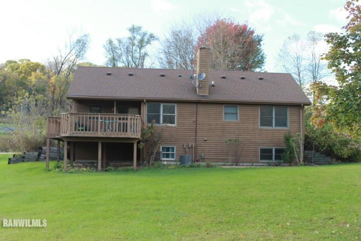 122 North Brodrecht Road Galena, IL 61036 - Photo 2 of 23 a front view of a house with a garden and yard