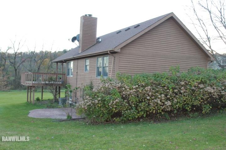 122 North Brodrecht Road Galena, IL 61036 - Photo 3 of 23 a front view of a house with garden