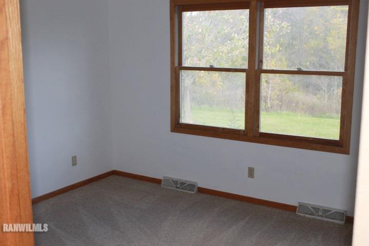 122 North Brodrecht Road Galena, IL 61036 - Photo 9 of 23 an empty room with a window