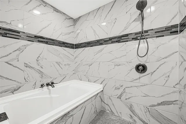 a bathroom with a sink and a shower