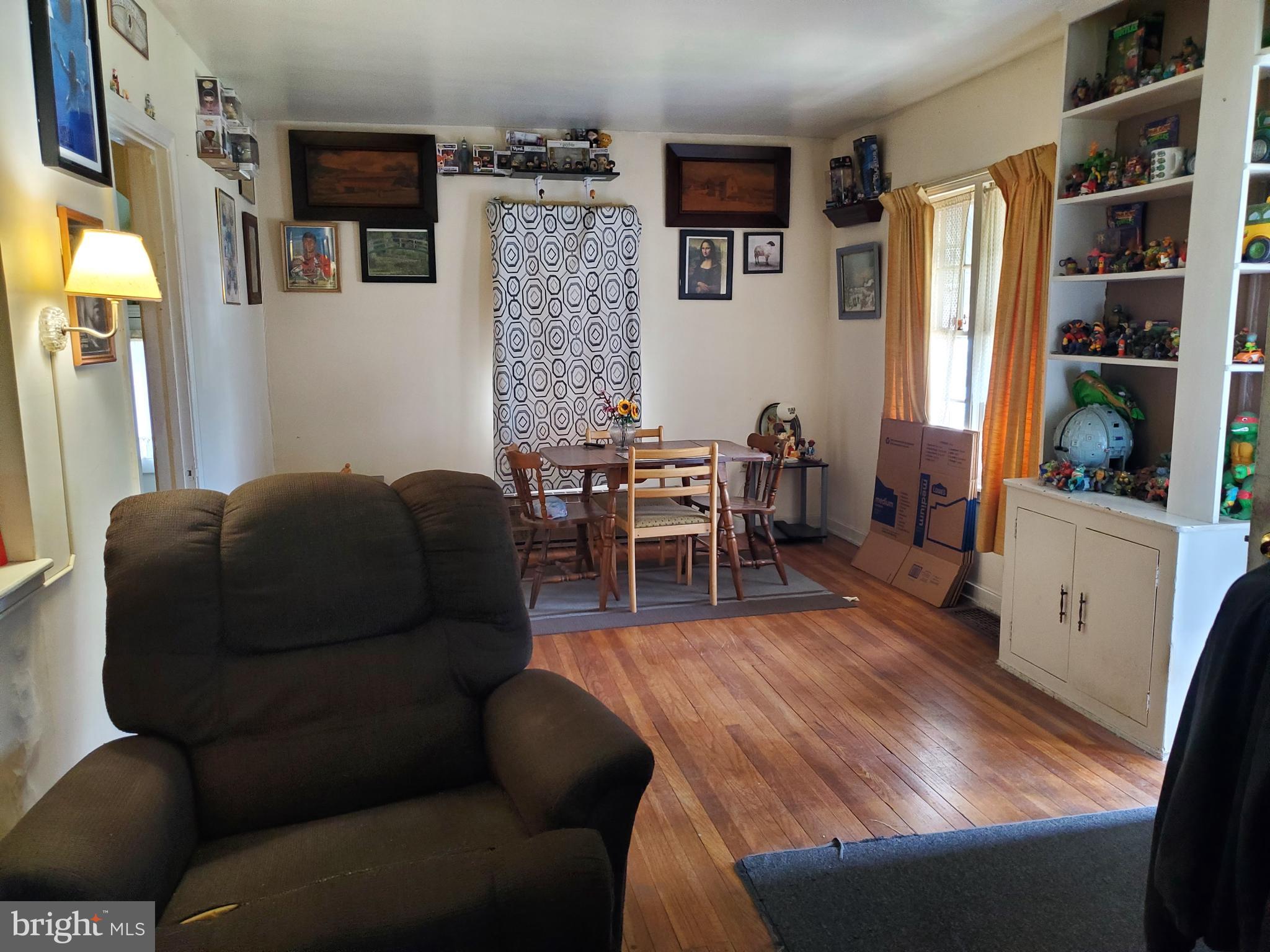 2638 Fairview Avenue Reading, PA 19606 - Photo 13 of 24 a living room with furniture and a dining table