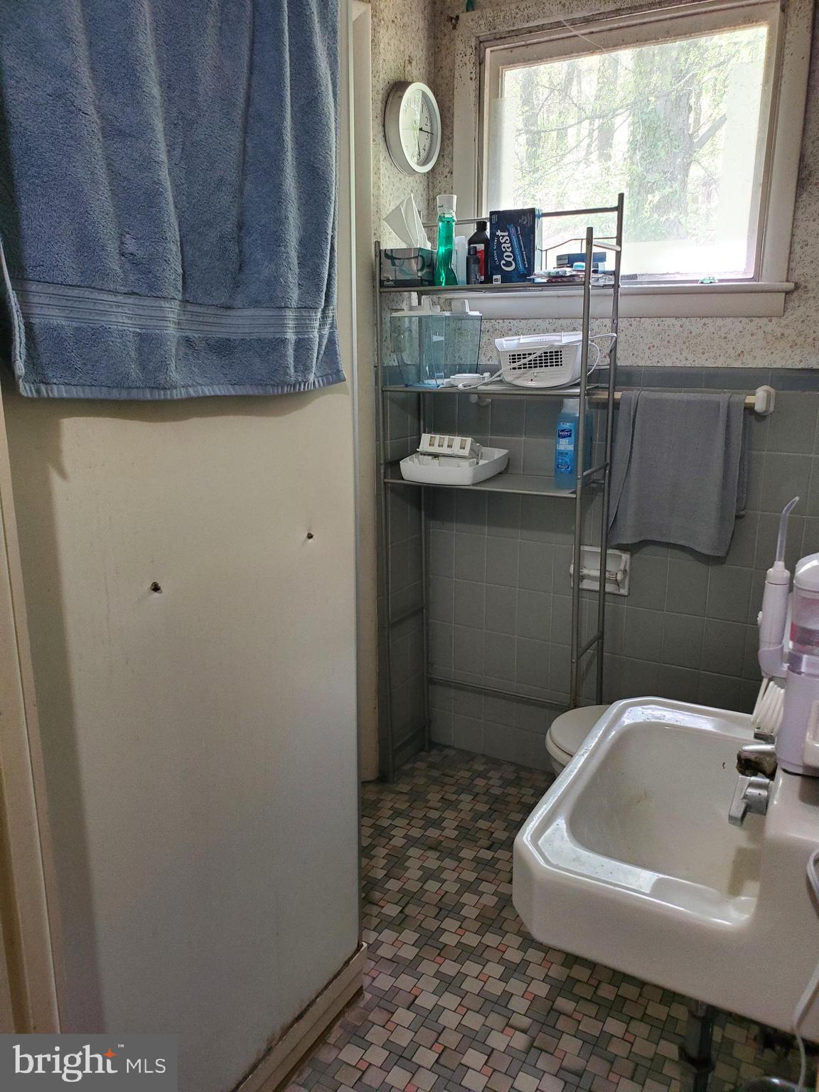 2638 Fairview Avenue Reading, PA 19606 - Photo 19 of 24 a bathroom with a sink a toilet and a window