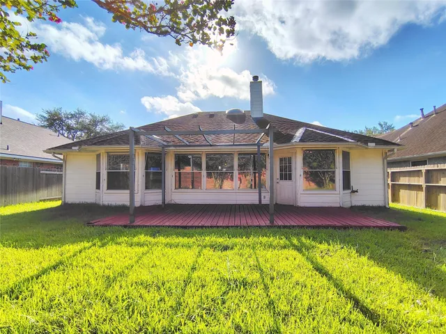 a view of house with a swimming pool