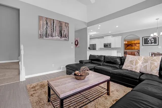 a living room with furniture and a large window
