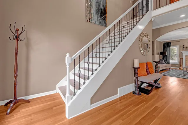 a living room with furniture and a chandelier