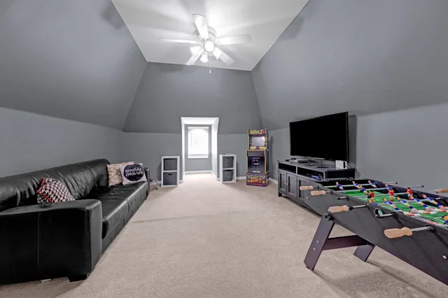 a living room with furniture and a rug