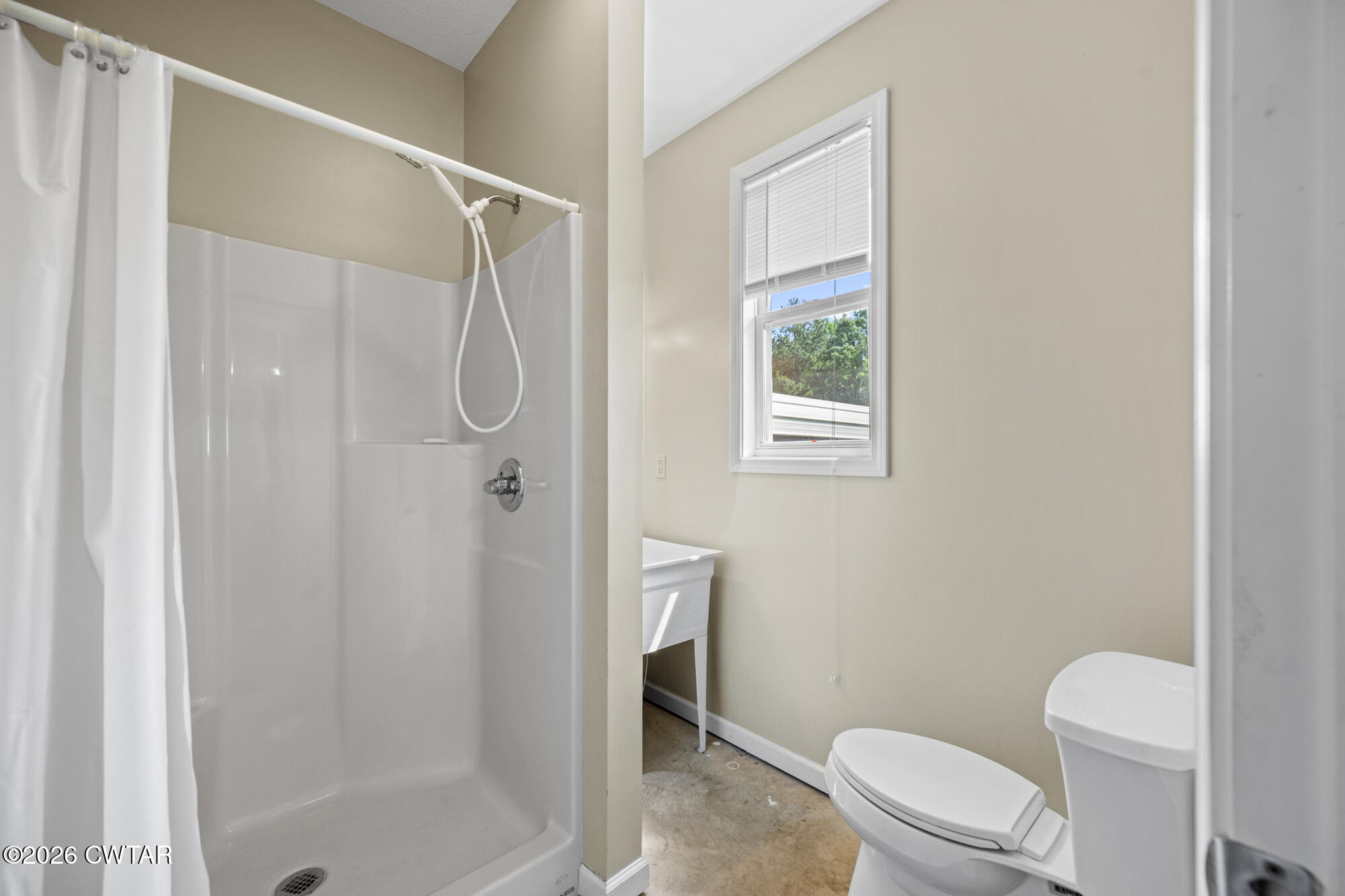 492 Joe Horton Road Lexington, TN 38351 - Photo 33 of 49 a white toilet sitting next to a shower