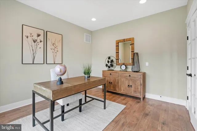 a bathroom with double vanity sink and a mirror