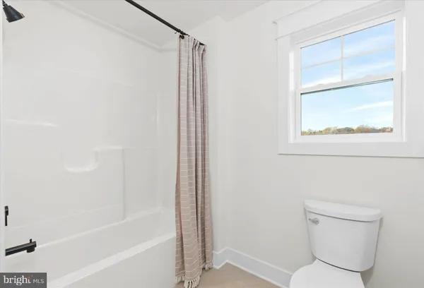 a bathroom with a double vanity sink a mirror and a shower