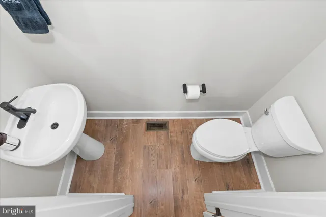 a bathroom with a shower and toilet