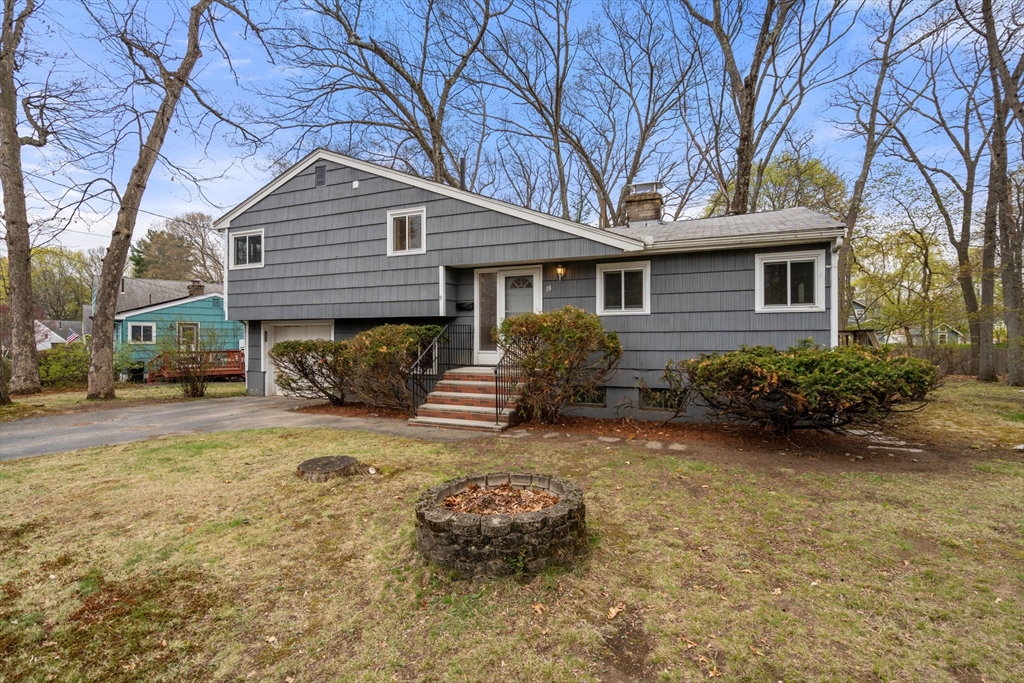 18 Royce Road Framingham, MA 01701 - Photo 24 of 30 a front view of a house with garden