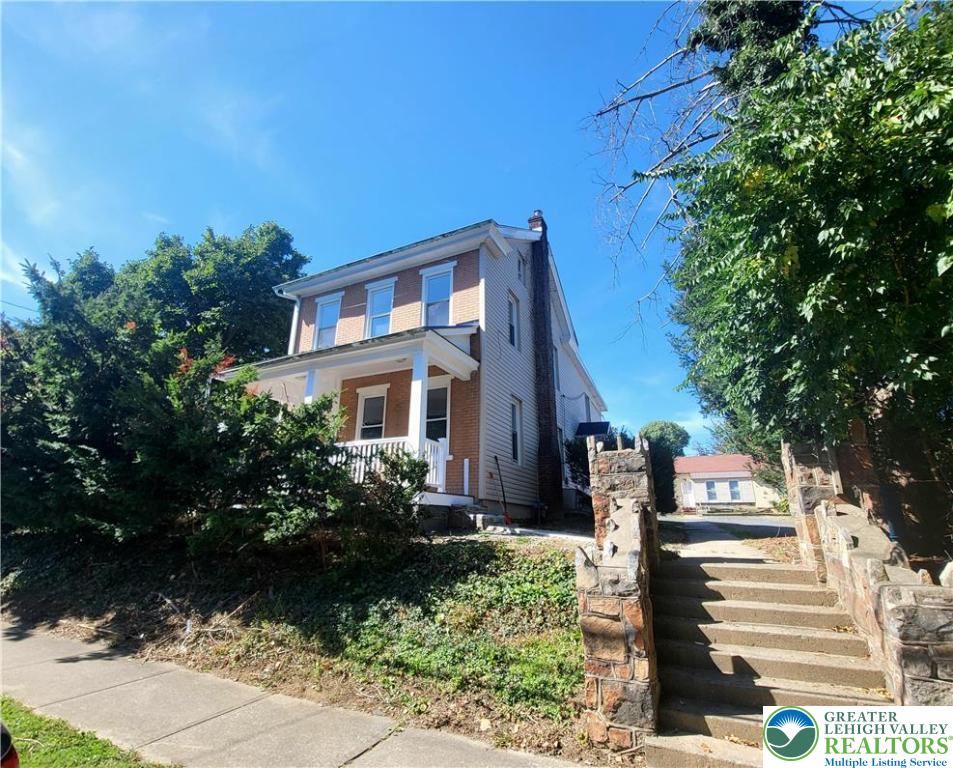 817 Seneca Street, Unit B Fountain Hill, PA 18015 - Photo 1 of 12 a front view of a house with a yard