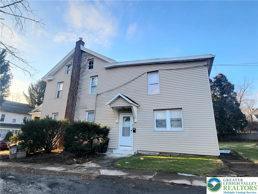 817 Seneca Street, Unit B Fountain Hill, PA 18015 - Photo 2 of 12 a view of a house with a yard
