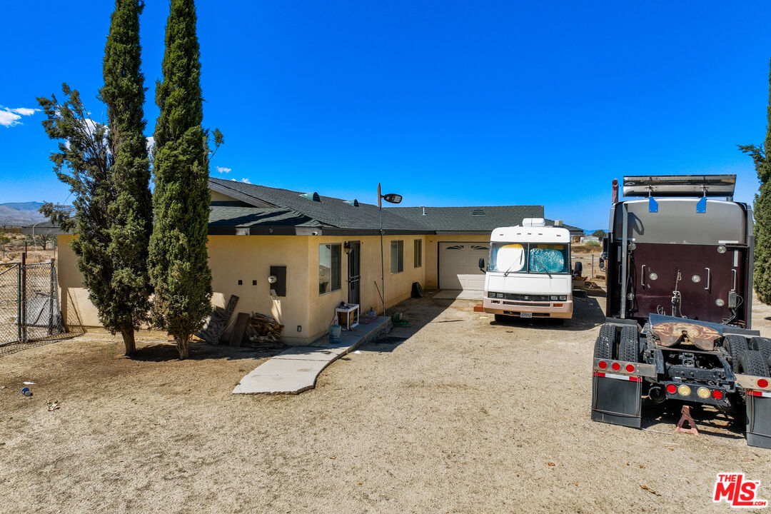 36901 165th Street East Llano, CA 93544 - Photo 17 of 18 a view of a house with a patio