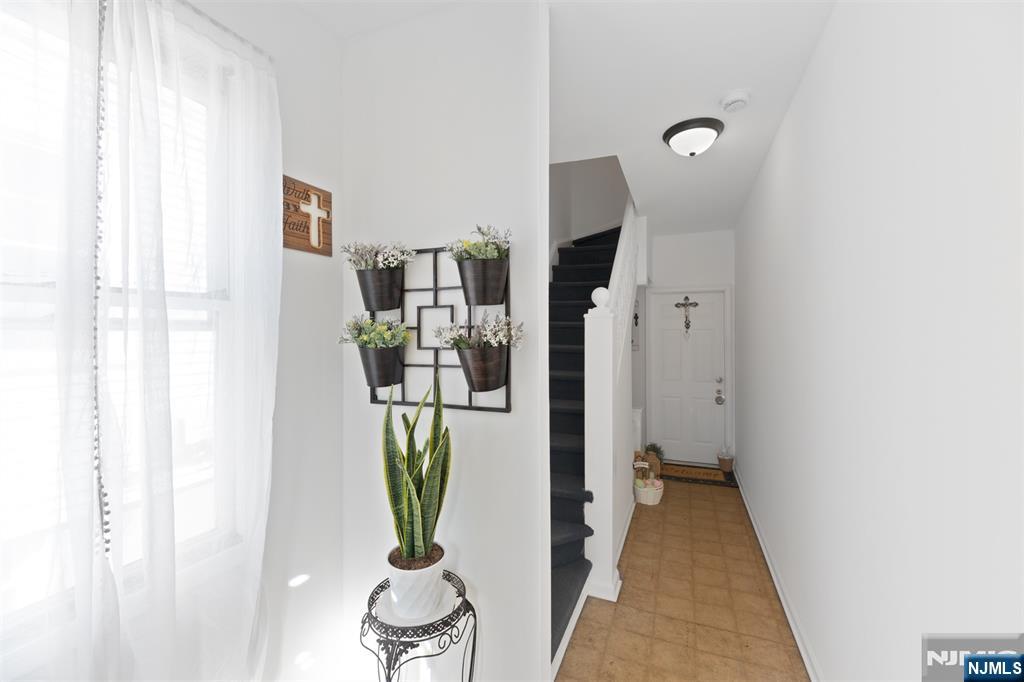 118 Ray Street, Unit 2 Garfield, NJ 07026 - Photo 15 of 15 a view of a hallway with living room