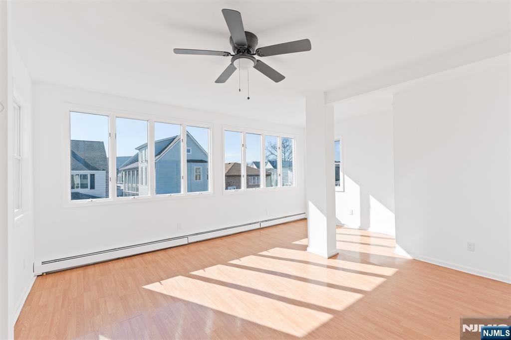 118 Ray Street, Unit 2 Garfield, NJ 07026 - Photo 3 of 15 a front view of a house with a ceiling fan