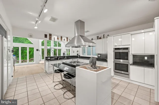 a view of a chair and table on the wooden deck