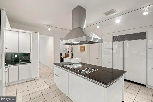 a spacious bedroom with a bed and a large window