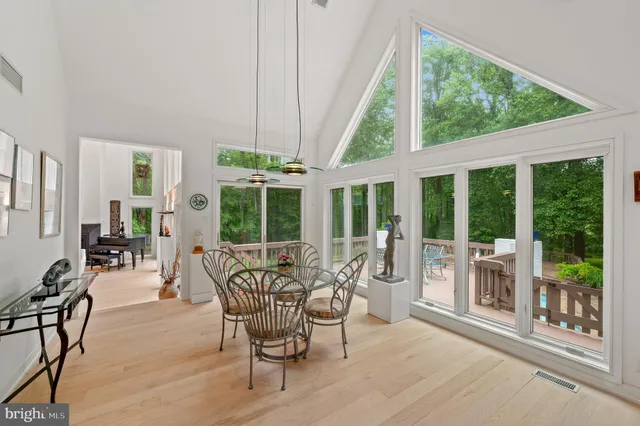a bathroom with a granite countertop sink and a large mirror