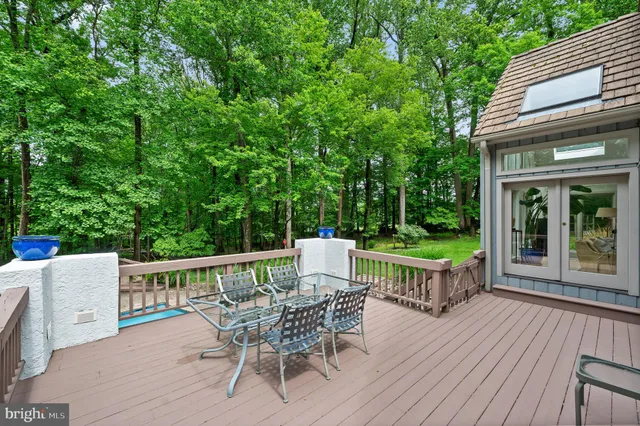 a bathroom with a tub shower and window