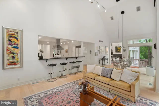 a spacious bedroom with a bed and a couch