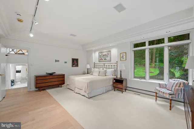 a bedroom with furniture and a two chair