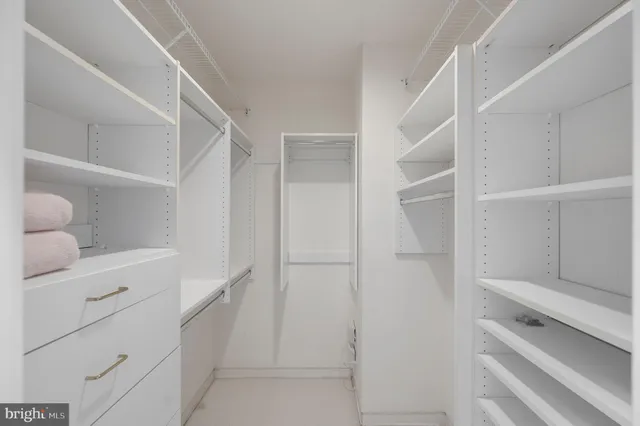 a room with pool table and windows