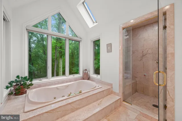 a room with pool table and windows