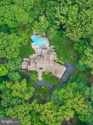 a living room with furniture a table and a large window