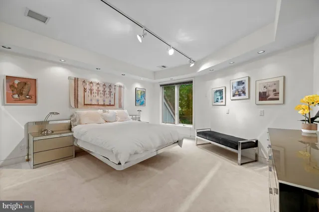 a room with a bed and furniture