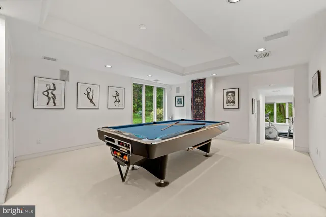 a view of a house with swimming pool and a yard