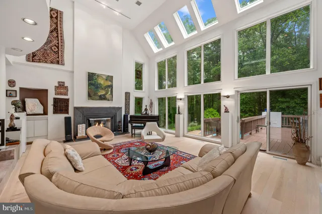 a kitchen with stainless steel appliances kitchen island granite countertop a refrigerator and a stove