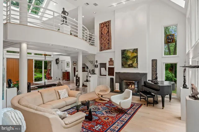 a living room with furniture and large window