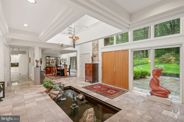 a kitchen with stainless steel appliances a stove a sink and a refrigerator