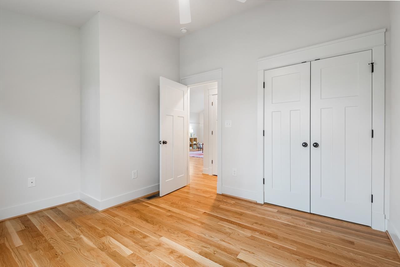 601 Jerome Road Durham, NC 27713 - Photo 43 of 52 a view of empty room with wooden floor
