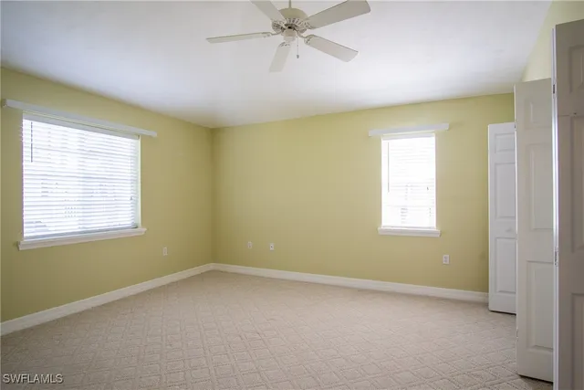 an empty room with a fan