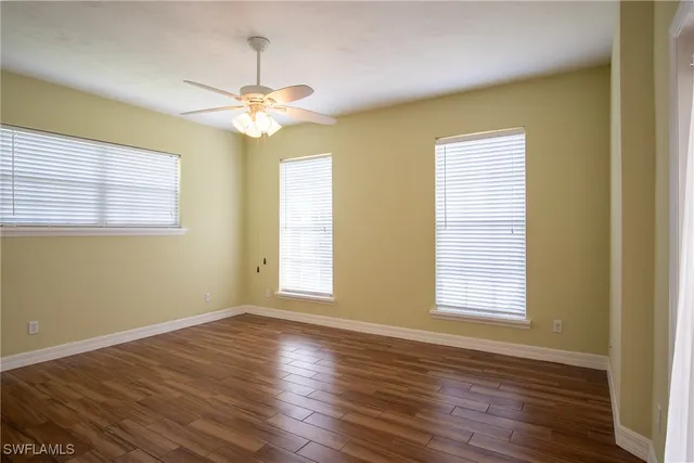 a bathroom with a sink mirror vanity and toilet