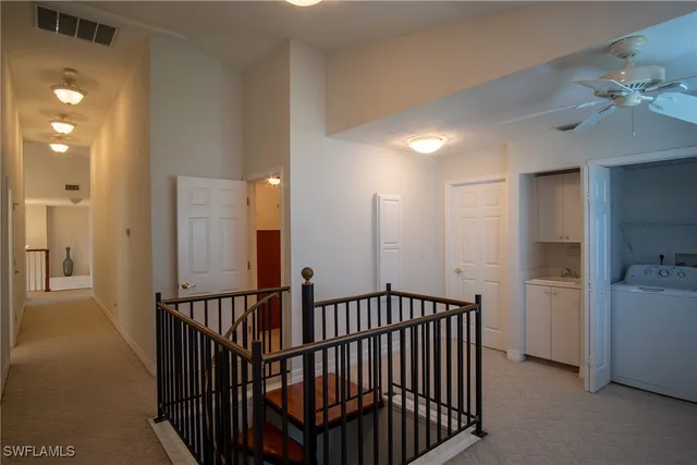 a view of a hallway with a window