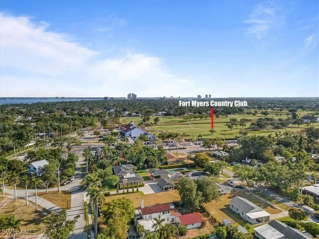 front view of a house with a tree