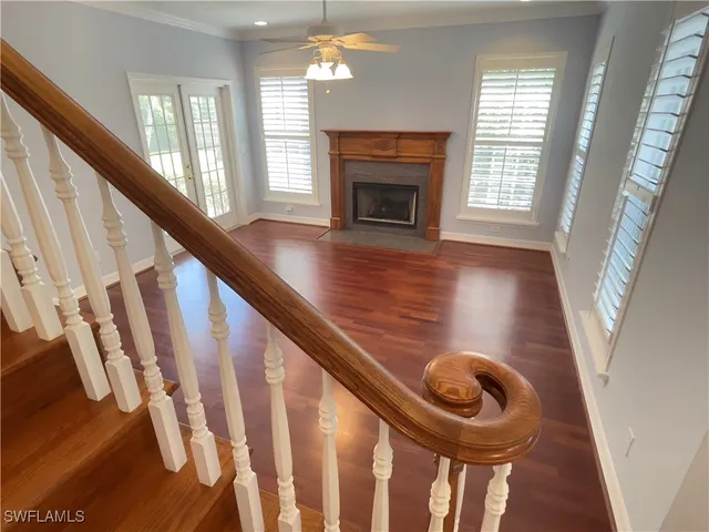 a view of an entryway with wooden floor