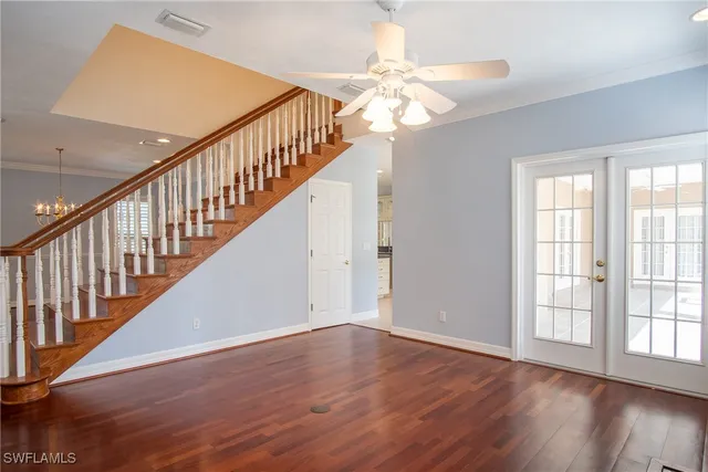 a view of an entryway with wooden floor